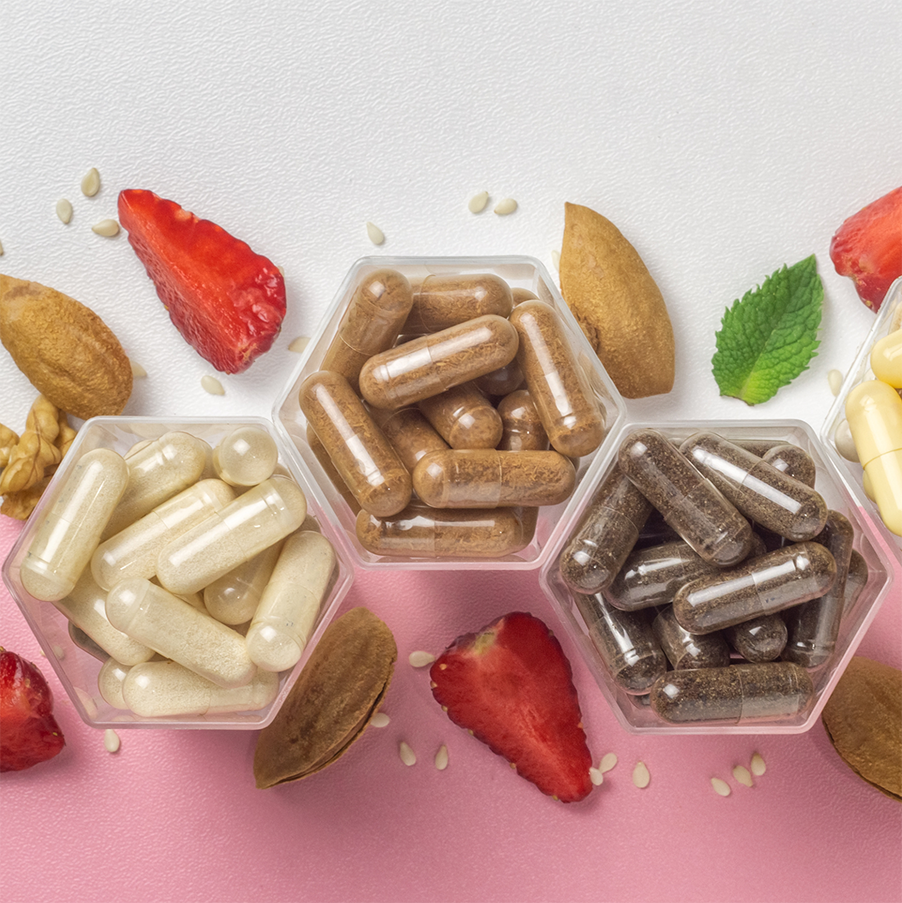 supplements shown with natural ingredients like strawberries and mint leaves and nuts and seeds