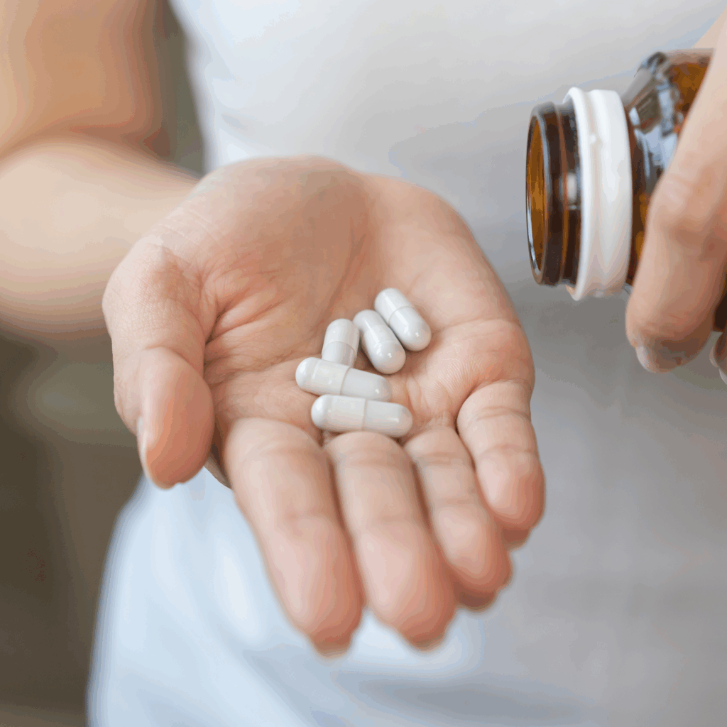 woman with capsules in her hand