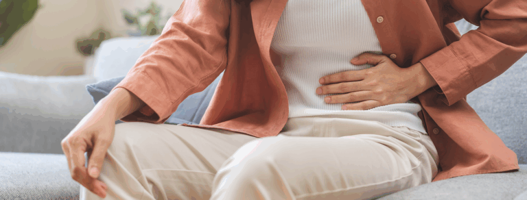 woman holding stomach