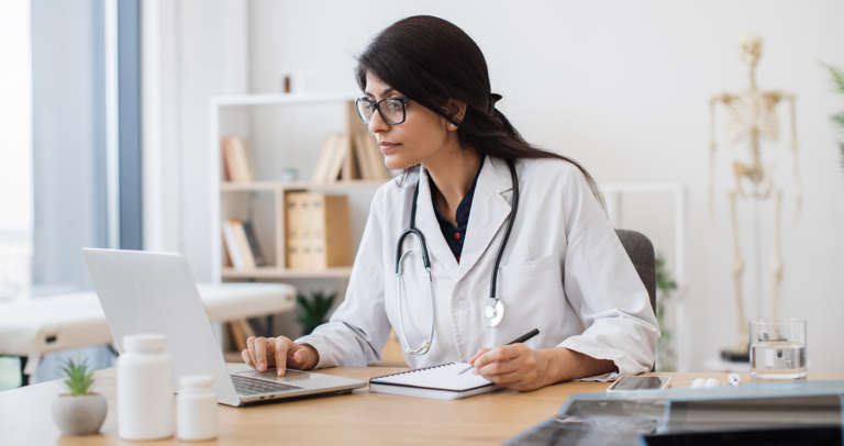 healthcare practitioner on computer