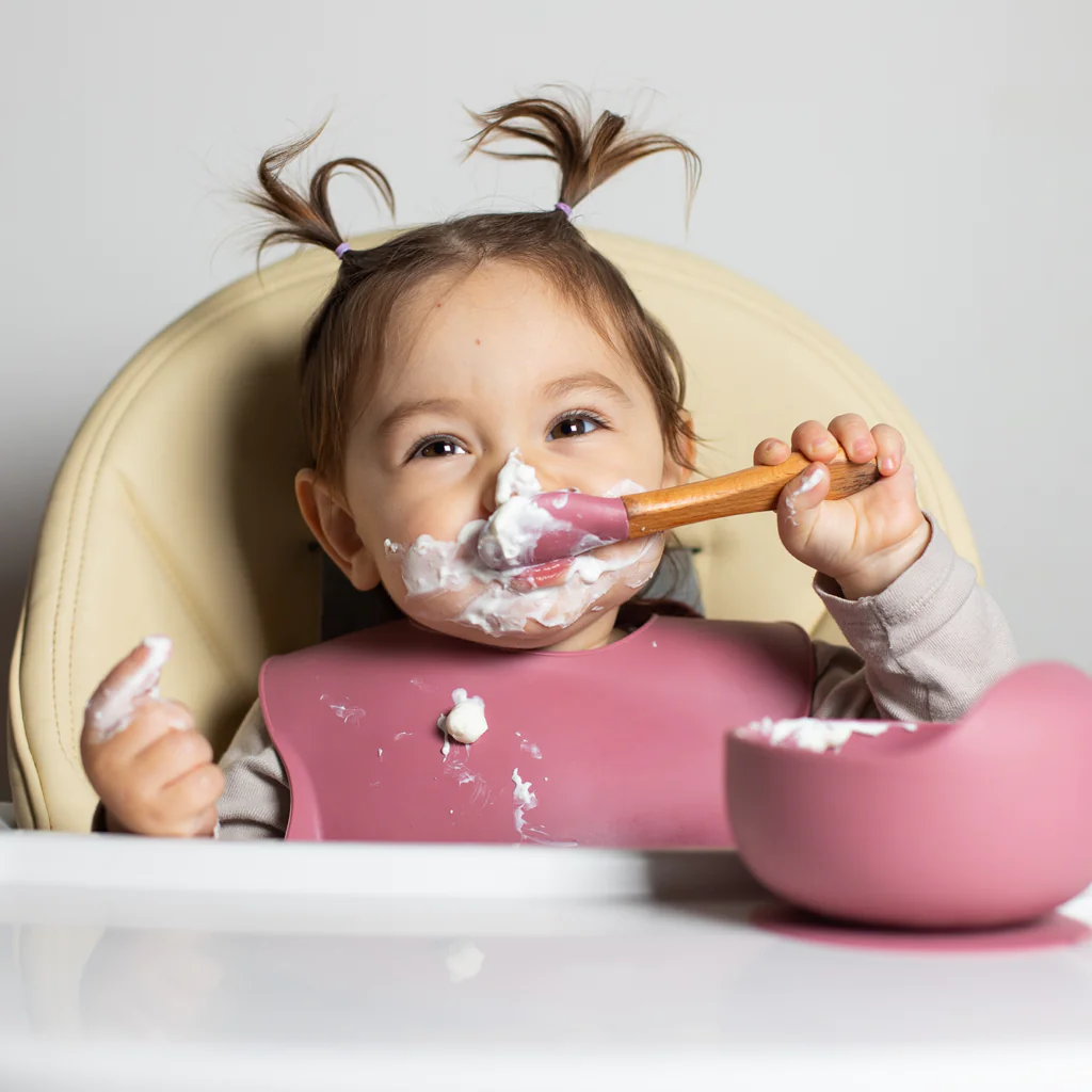 baby eating yogurt