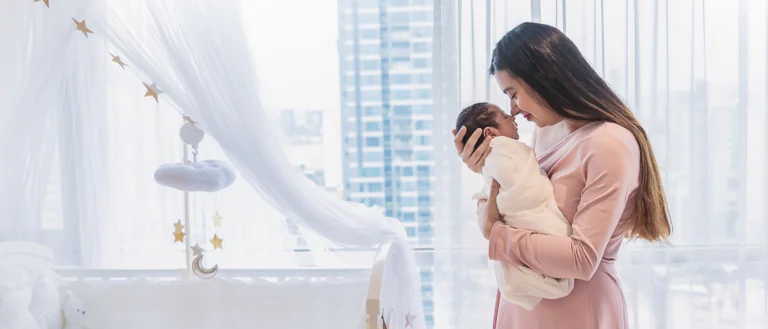 woman holding newborn baby