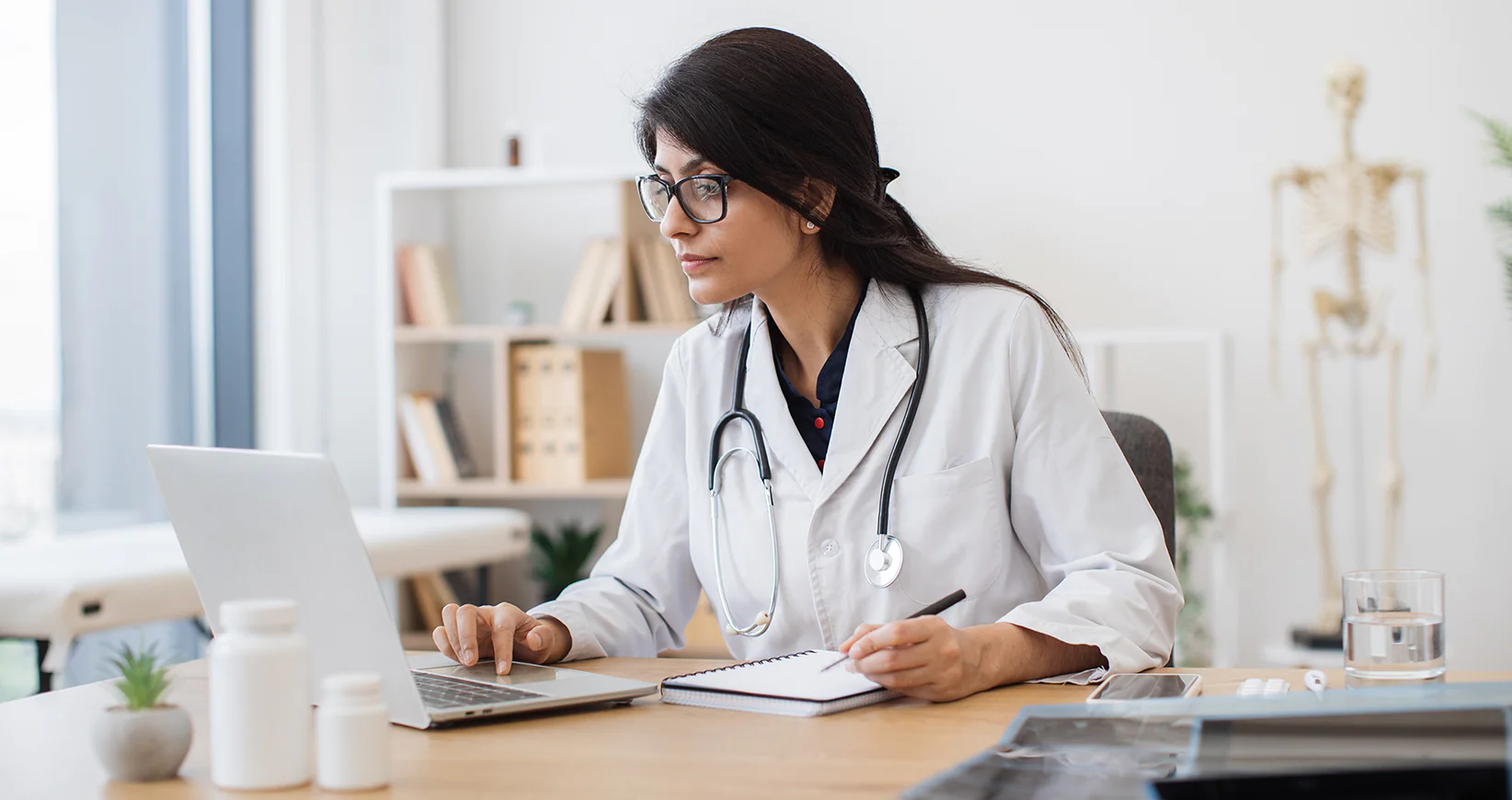 healthcare practitioner on computer